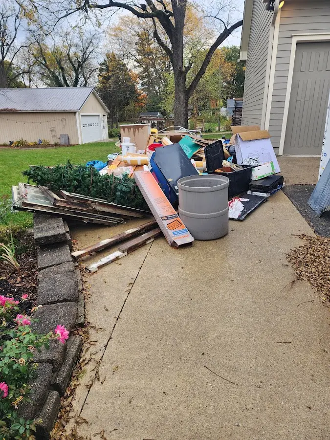 Dumpster being loaded with debris for Commercial Dumpster Rental in Tahlequah